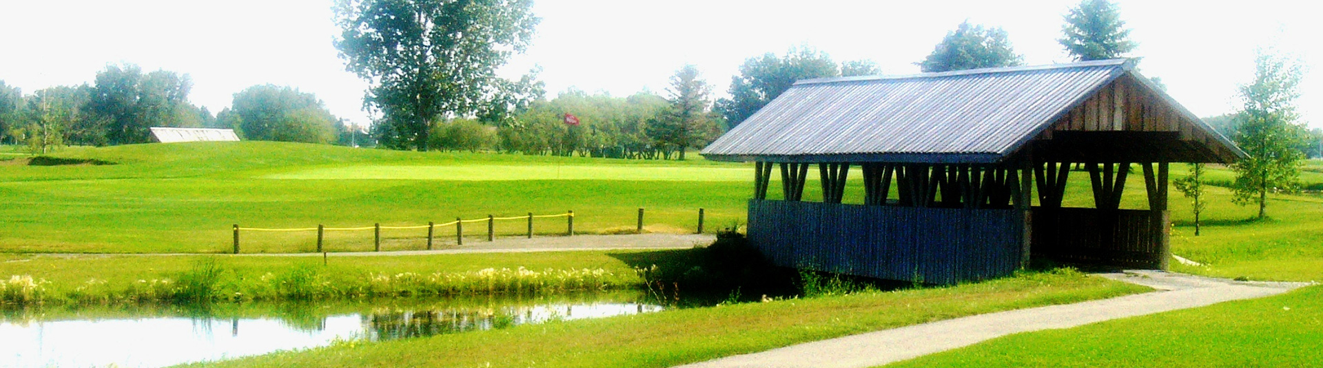 view of golf course with bridge